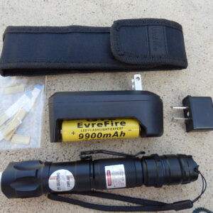 a black flashlight with a battery and a case