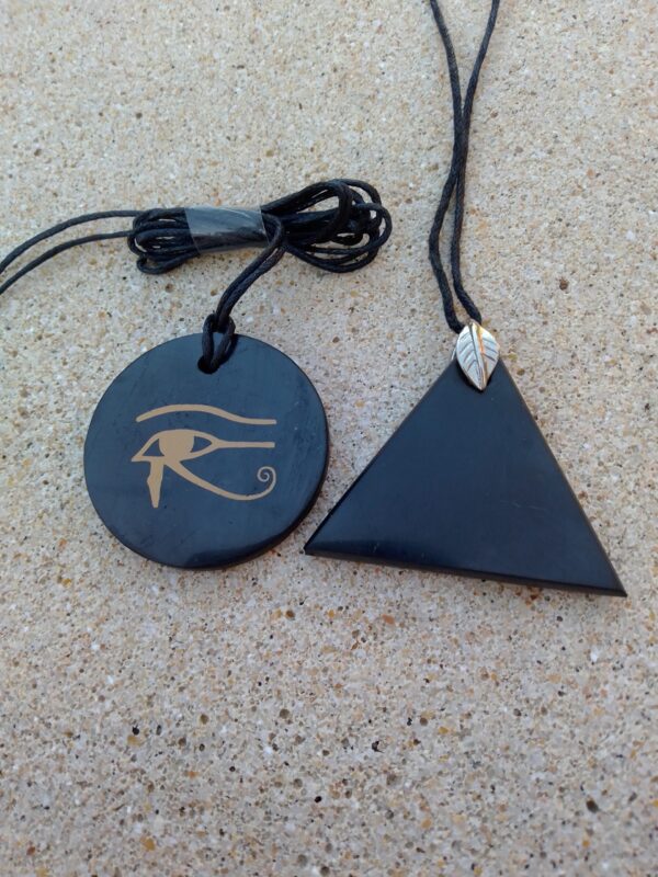 a black necklaces with a triangle and an eye of horus